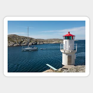 a sailboat passes the lighthouse Sticker